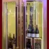 Full length glass wine cellar door with wood frame for a high end restaurant wine cellar design