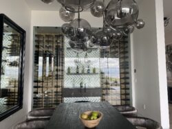 4 - Frameless Glass Custom Wine Cellar Doors Designed in a Dining Area in Dana Point Stylish Modern Wine Cellars in a Dining Room in California