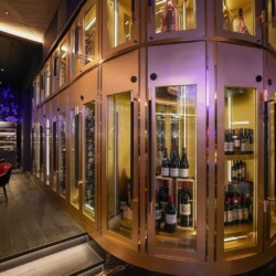 3 - Our restaurant wine cellar design for this luxury spot was fit for high ceilings. Curated display for an Orange County custom restaurant wine cellar design.