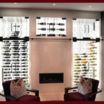 Look at how these frameless glass wine cellar doors provide an unobstructed view to the cable wine racks. An opulent wine display enclosed in frameless glass wine cellar doors.