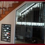 You can have frameless glass wine cellar does custom-made to fit them in irregular spaces like this under-the-stairs wine cellar. Frameless glass wine cellar entrance under the staircase.