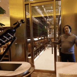 A massive glass door gives customers a sneak peak of Nico's commercial wine racking display.