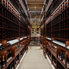 From the flooring to the commercial wine racks, lighting, layout, and more, everything in here was custom-designed and built!