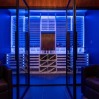 When in party mode, this custom modern wine room can be transformed to set the ambiance of the room.