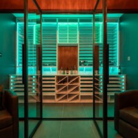 RGB lights make custom modern wine rooms look futuristic.