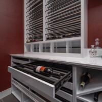 Deep custom drawers that can smoothly slide in and out make for a stylish bottle storage.