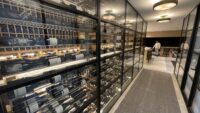 (3) Matte-black metal frames added depth to this modern glass wine cellars' glass enclosure.