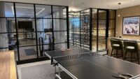 (5) No matter how warm it gets in the den, this modern glass wine cellar will remain cool and dry with the help of its water-cooled split system cooling unit.