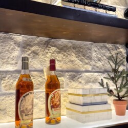 (5) Instead of a solid slab of wood for the shelves, we custom-built a shelf that has an acrylic light panel on top, to provide an elegant illumination to the bottles.