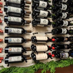 (6) Double-deep metal racks in glass dining room wine cellar give the illusion of floating bottles from afar and they don't take away attention from the bottles!