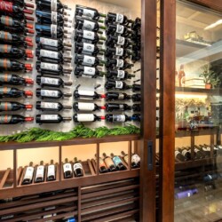 (8) This glass dining room wine cellar's sliding doors are space savers, considering the closet's large size.