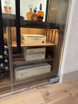 A wine wall that's not just for bottles but sentimental custom crafted boxes as well!