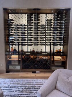 Frameless glass turns this wall wine cellar into a gallery-worthy wine display.