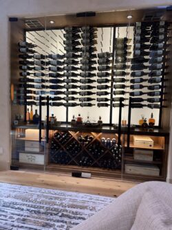 From glass panels to backlighting, every detail of this wall wine cellar was designed to impress.