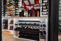 (7) Smart design meets modern style in this wine cellar for home, complete with custom pull-out bottle racks.