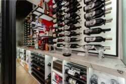 (4) A stunning glass-enclosed wine cellar for home entertainment spaces, offering a clear view of prized vintages.