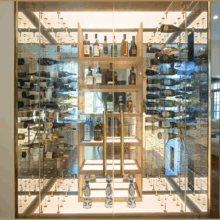 (3) Doesn't this wine display feel like it's in a museum? That's the power of combining glass and the right lighting plan.